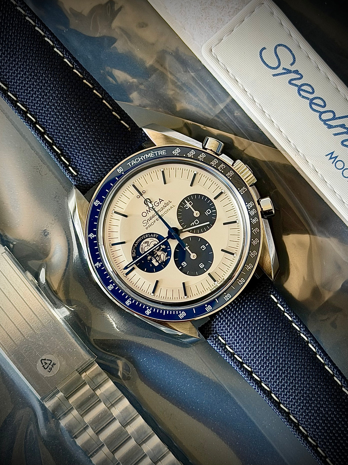 2023 OMEGA SPEEDMASTER “SILVER SNOOPY AWARD” 50TH ANNIVERSARY, 310.32.42.50.02.001, UNWORN SEALED BRACELET + WHITE STRAP, FULL SET, INC GST