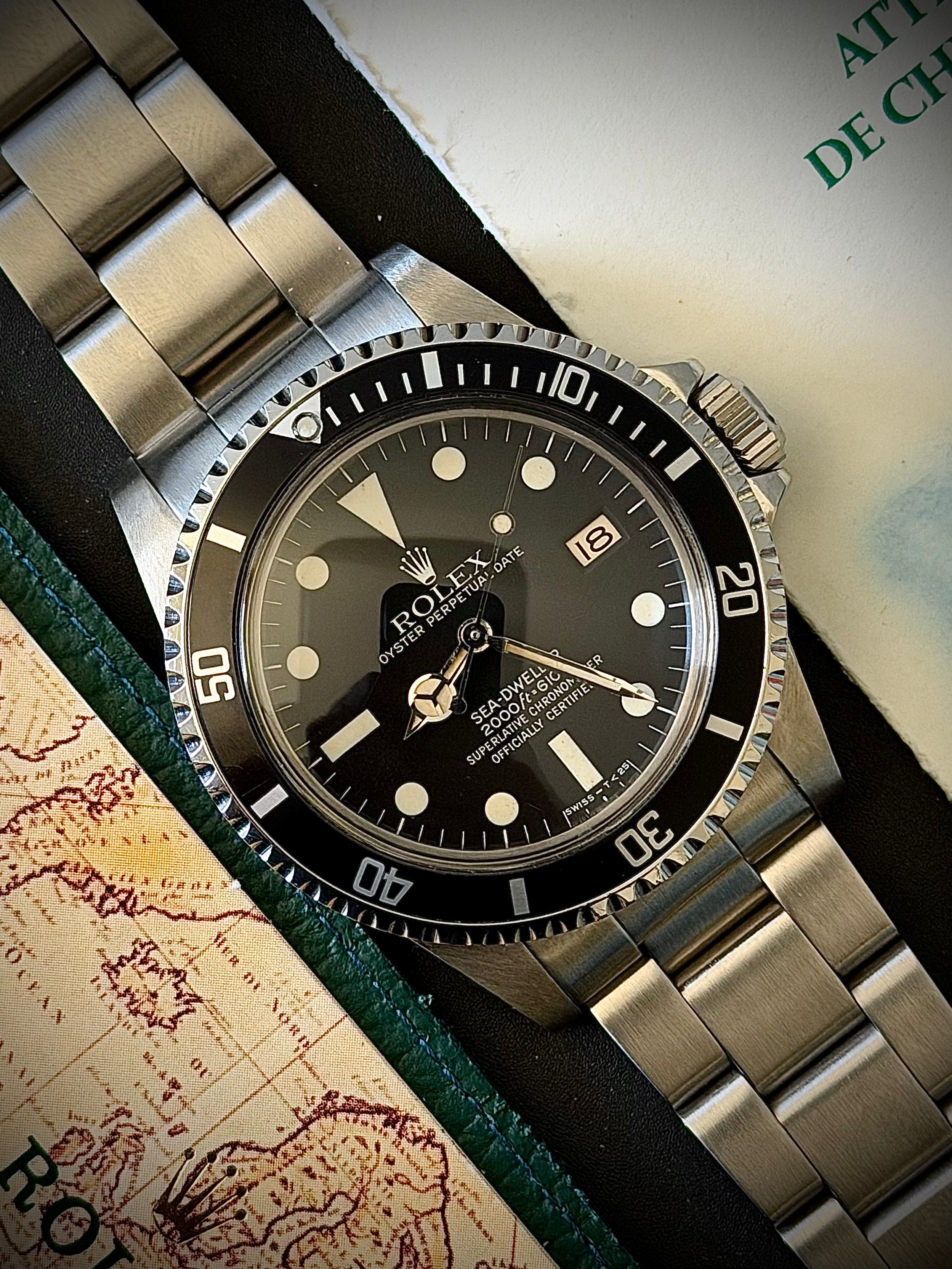 1981 ROLEX SEA-DWELLER 1665 “GREAT WHITE”, BOX AND PAPERS, INC GST