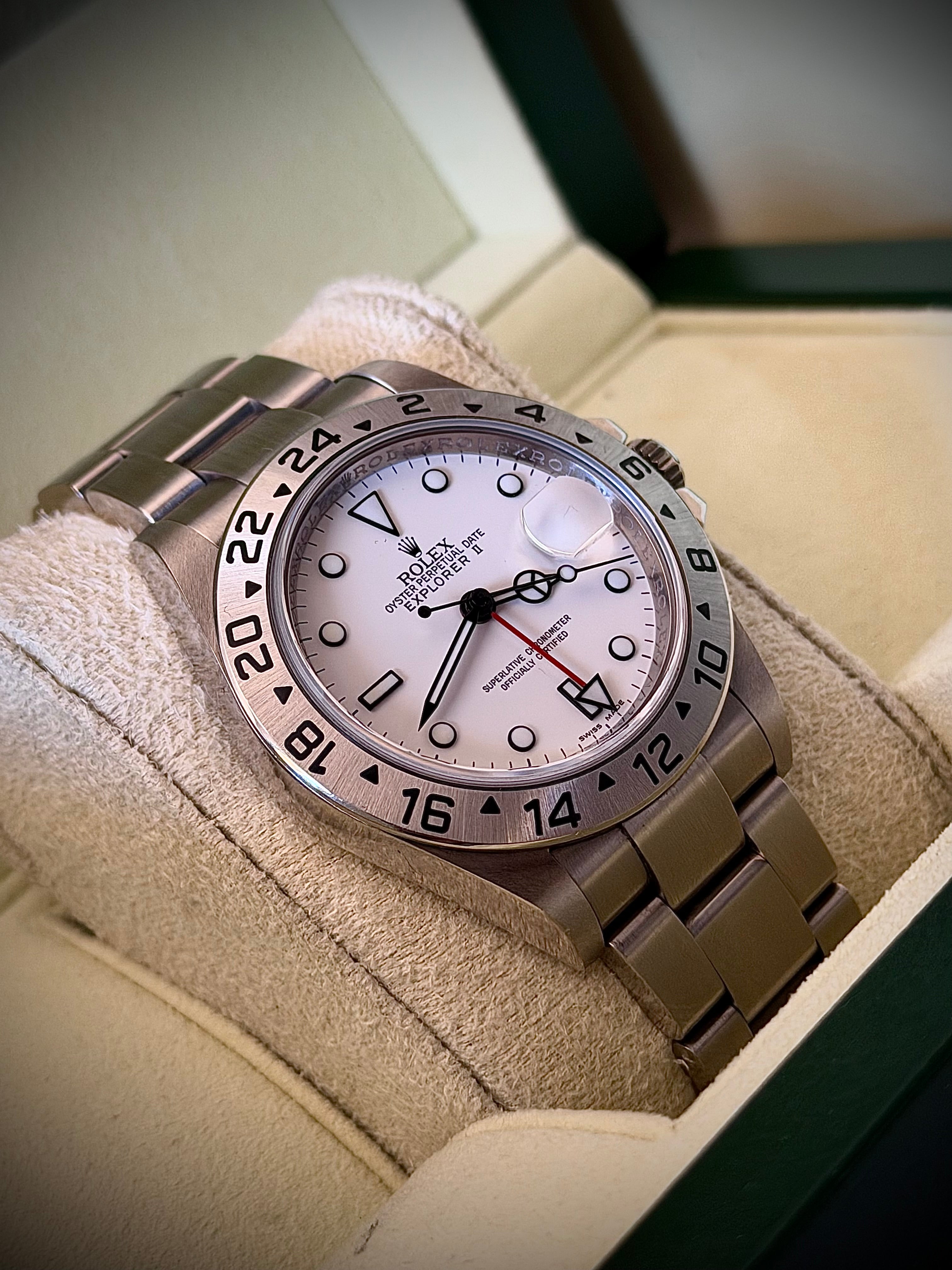 2011 ROLEX EXPLORER II, POLAR” 16570, NO HOLES SEL, ENGRAVED REHAUT, 3186 MOVEMENT, BOX BOOKLETS AND ORIGINAL RECEIPT, INC GST