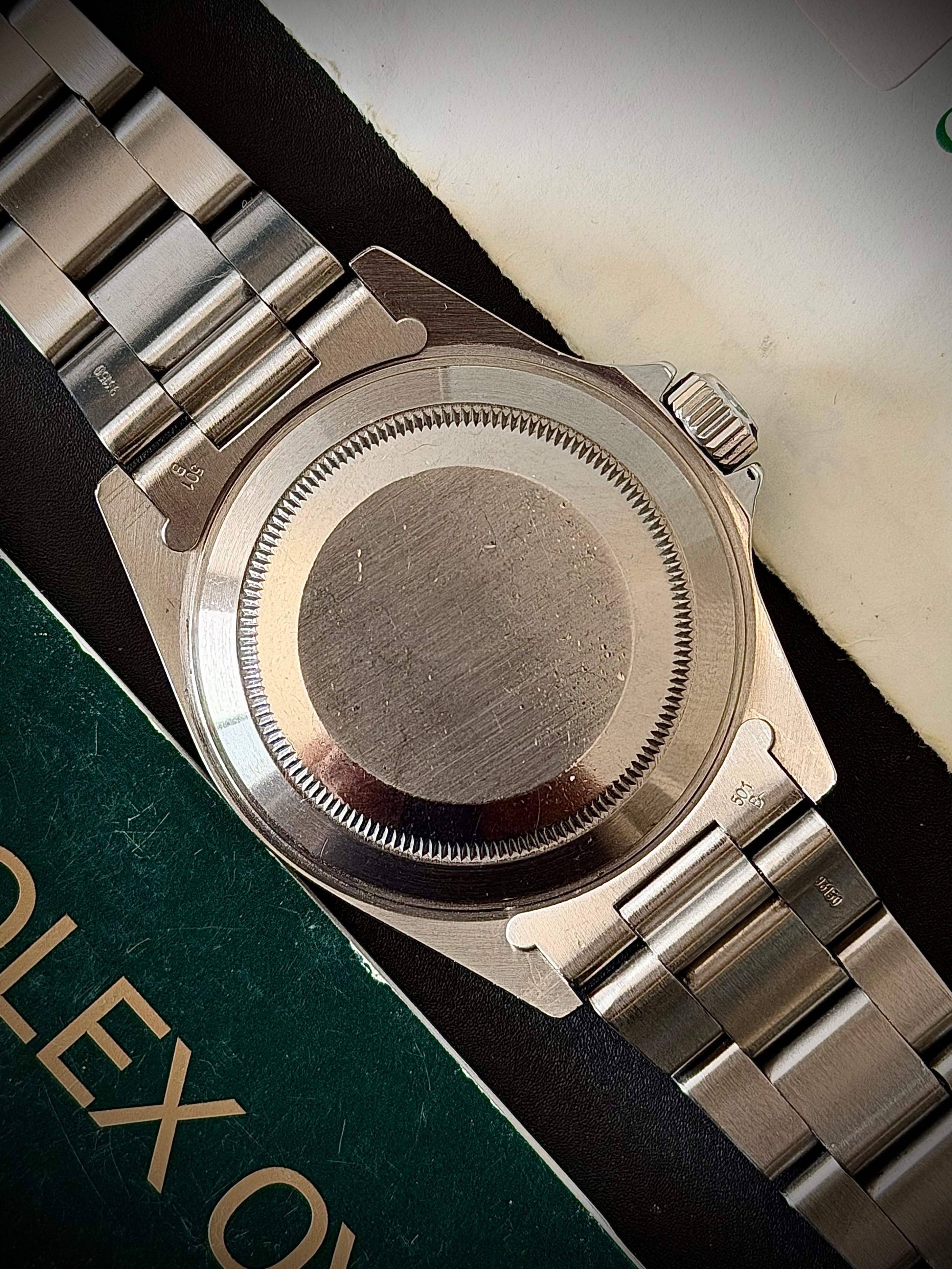 1997 ROLEX SUBMARINER NO-DATE, TWO LINER, 14060, BOX AND PAPERS, INC GST