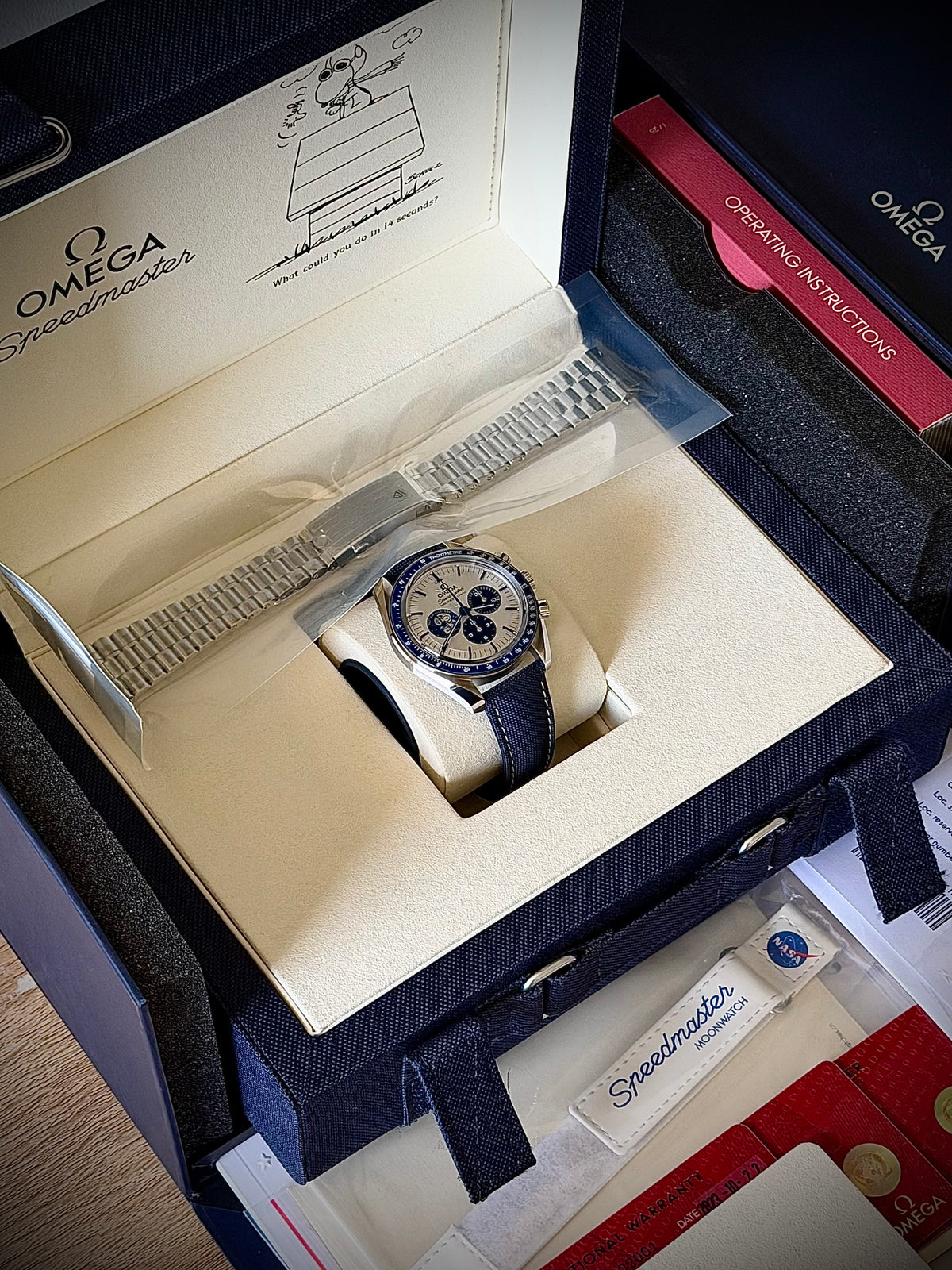 2023 OMEGA SPEEDMASTER “SILVER SNOOPY AWARD” 50TH ANNIVERSARY, 310.32.42.50.02.001, UNWORN SEALED BRACELET + WHITE STRAP, FULL SET, INC GST